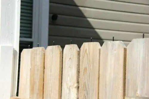 Spike Guard Tech anti-climb fence spikes installed on a metal fence for home protection